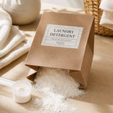Bag of non-toxic laundry detergent with a scoop on a wooden surface